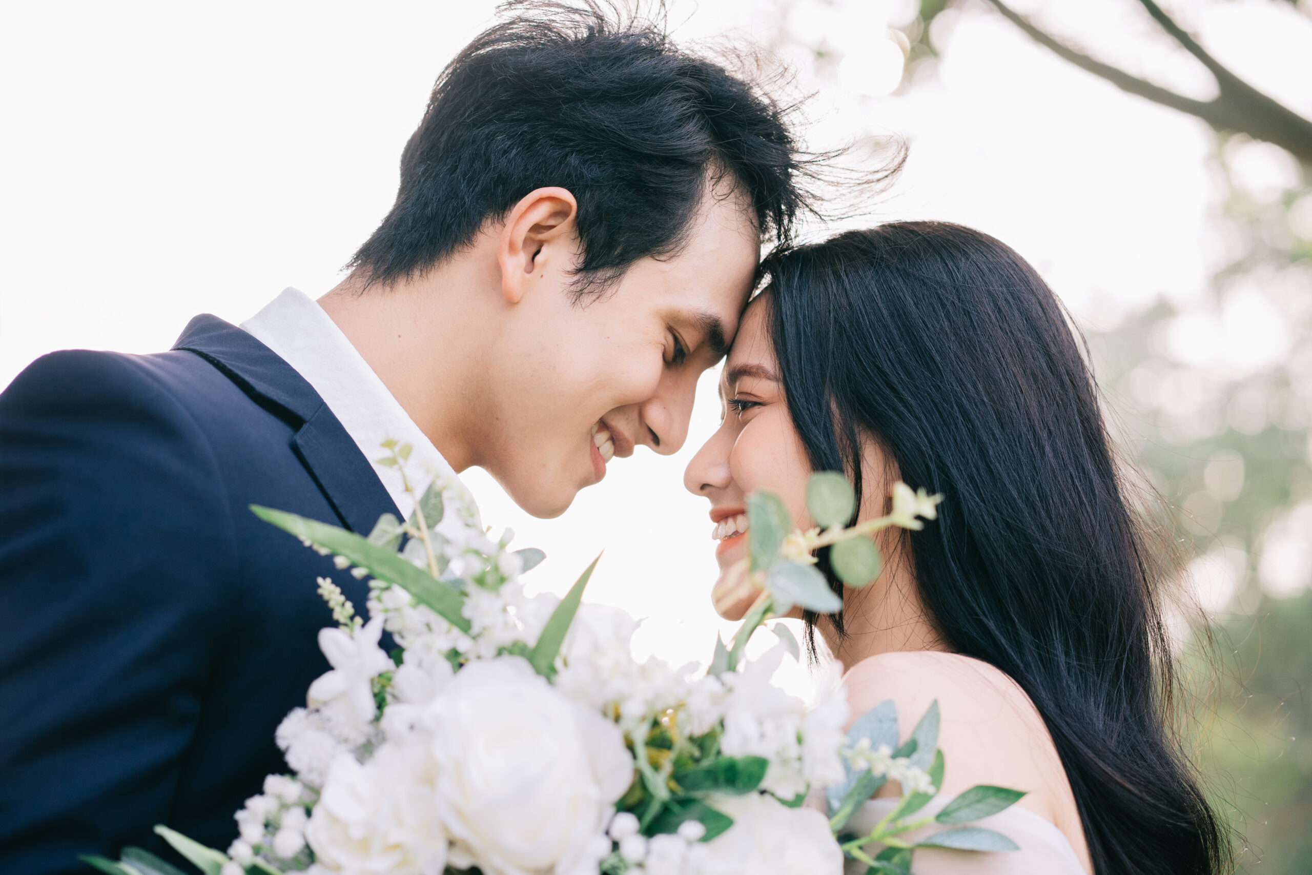 Image of young Asian bride and groom